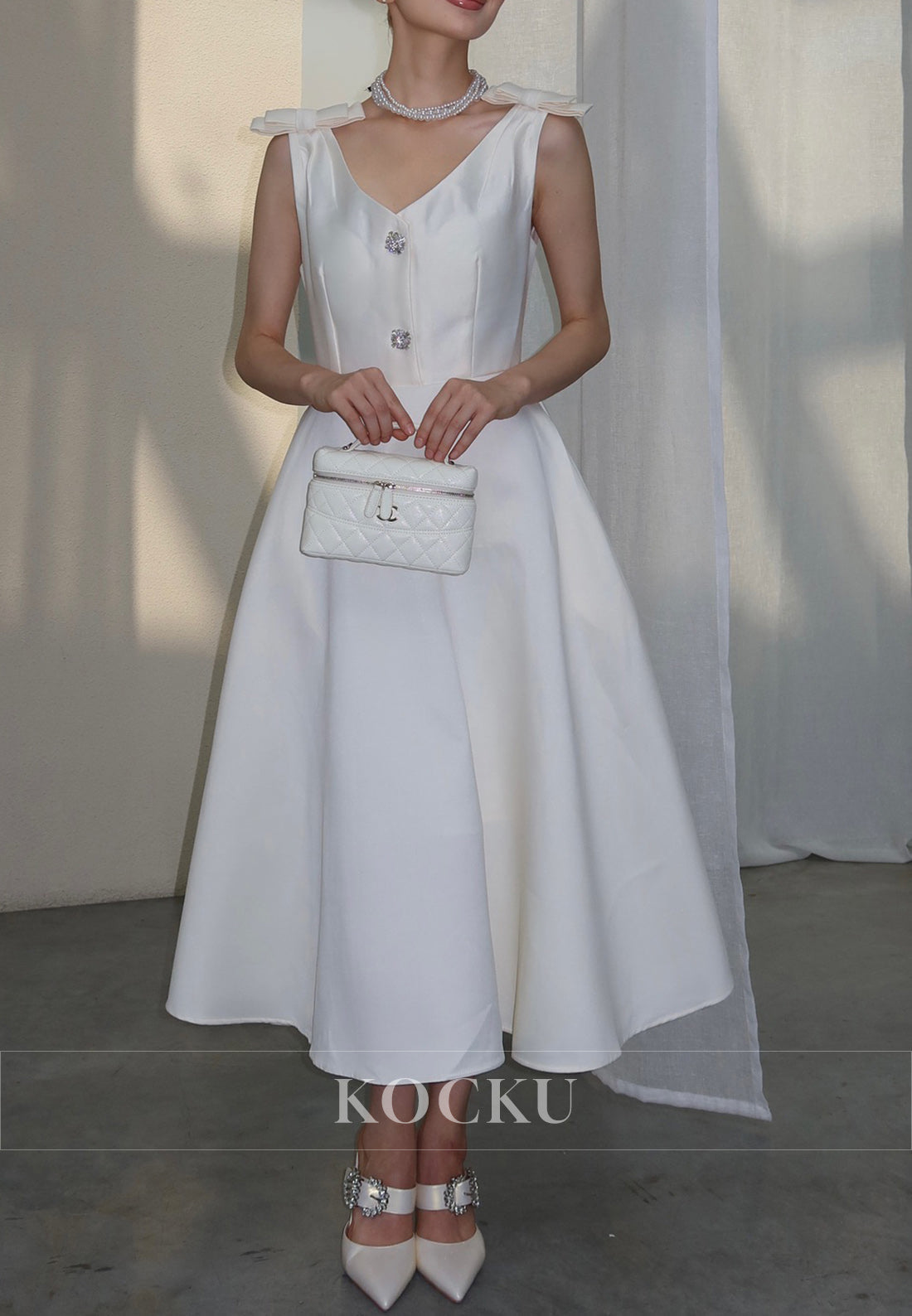 White Satin Midi Dress with Bow Shoulder Details and Crystal Buttons