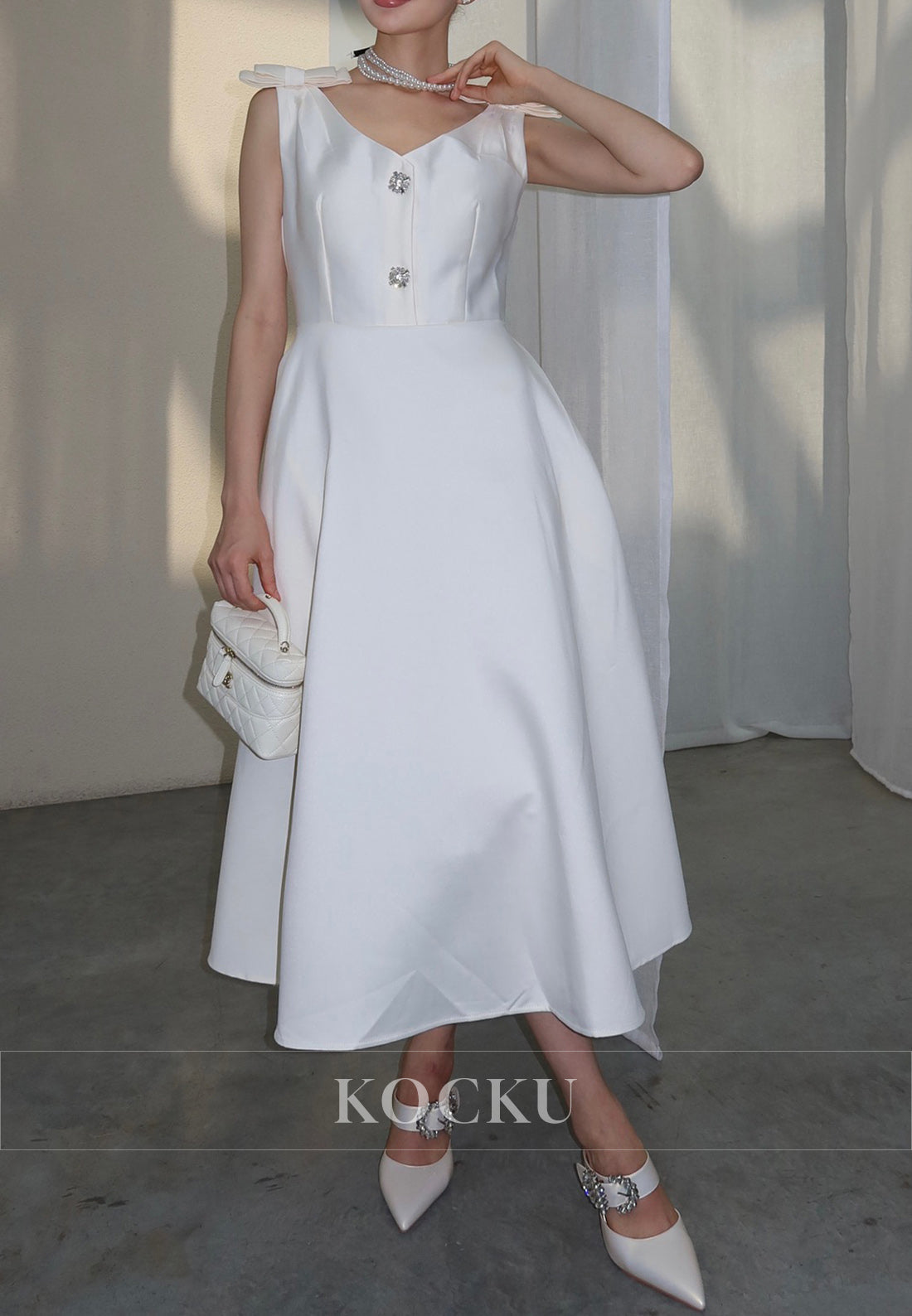 White Satin Midi Dress with Bow Shoulder Details and Crystal Buttons