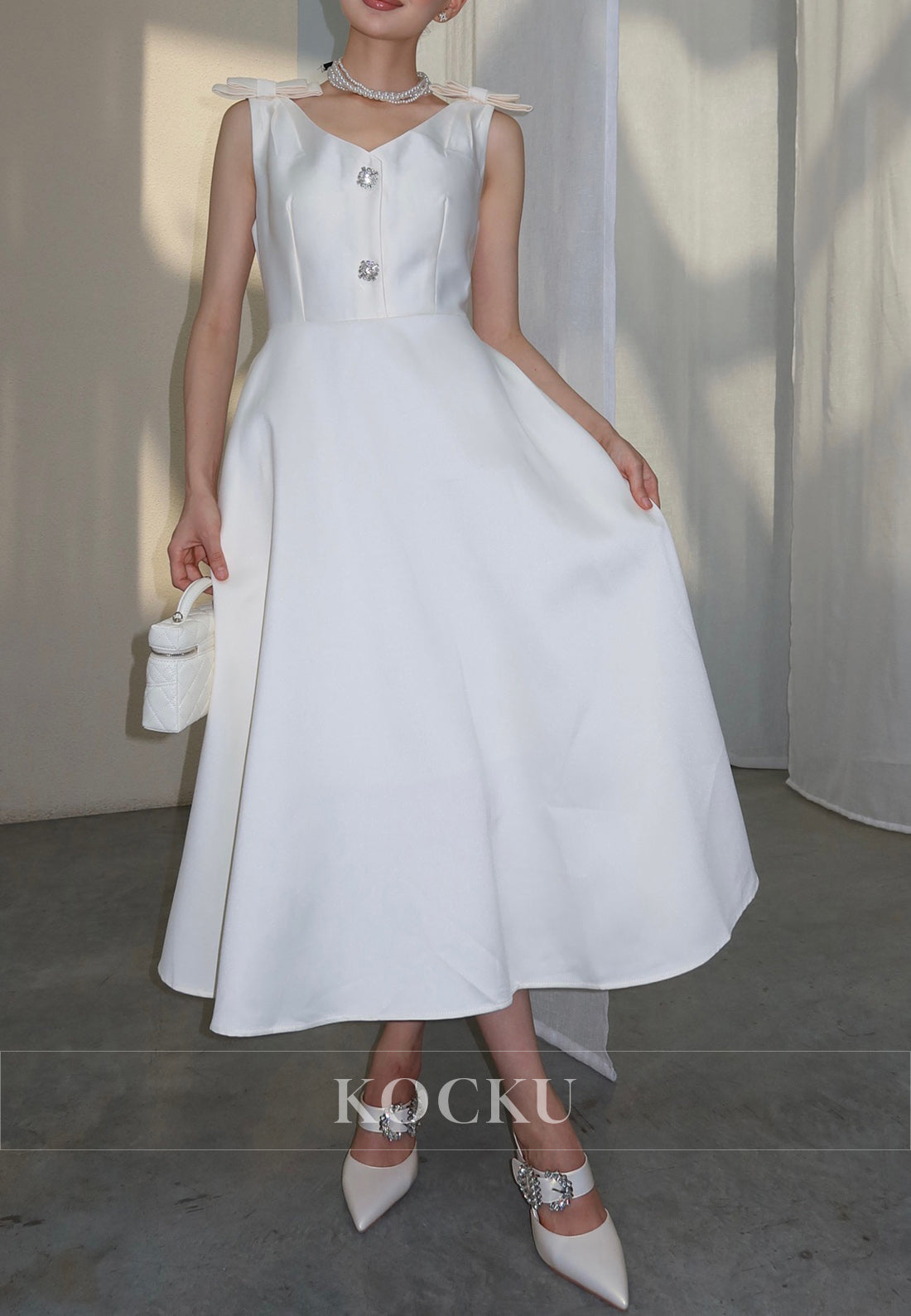 White Satin Midi Dress with Bow Shoulder Details and Crystal Buttons