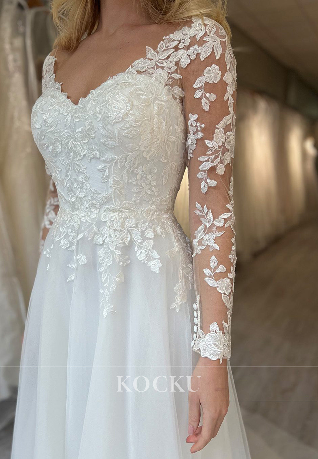 White Appliques Sweetheart Sheer Back A-Line Wedding Dress with Long Sleeves