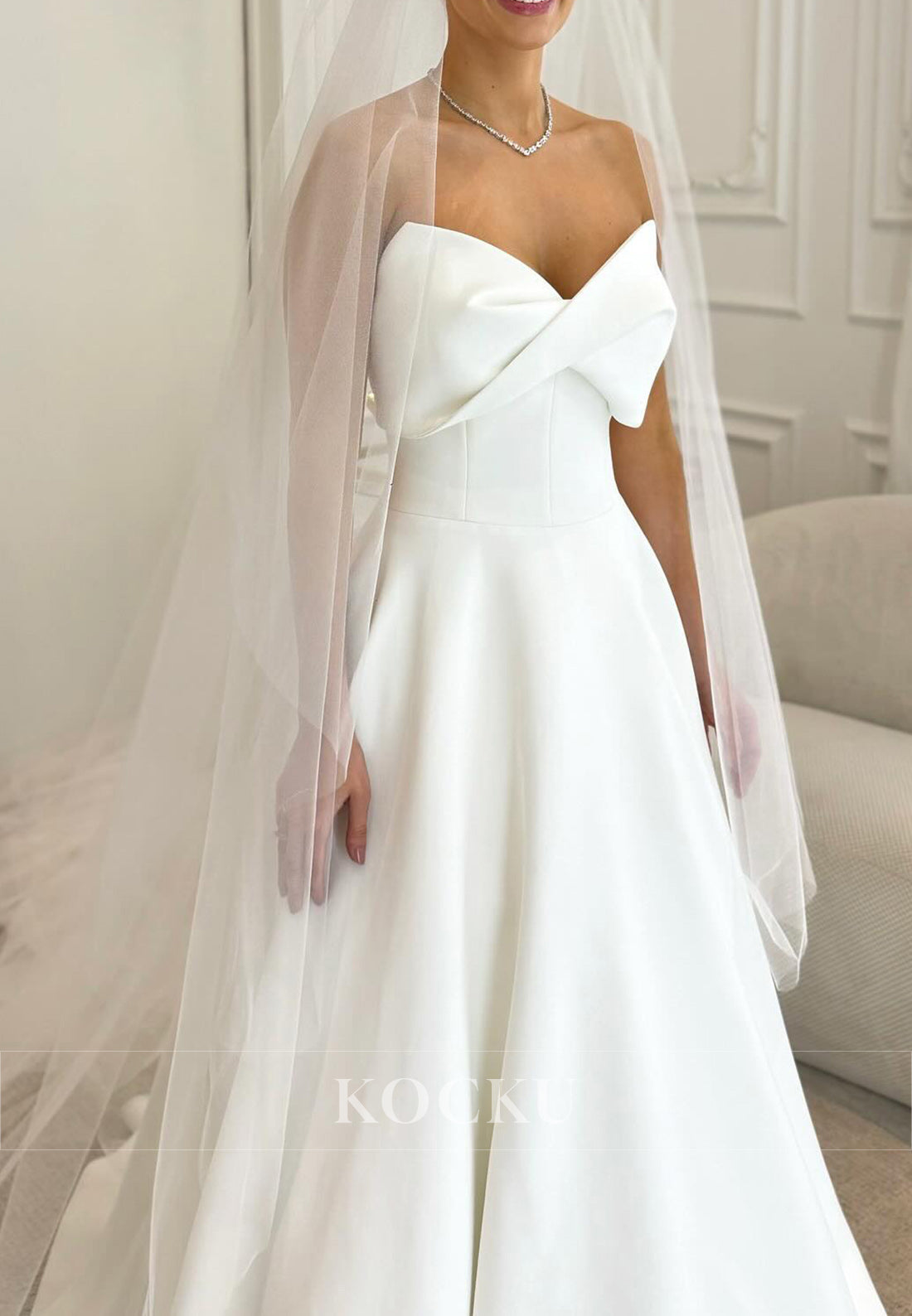 Timeless White Satin Wedding Gown with Bow Embellishment and Full Skirt