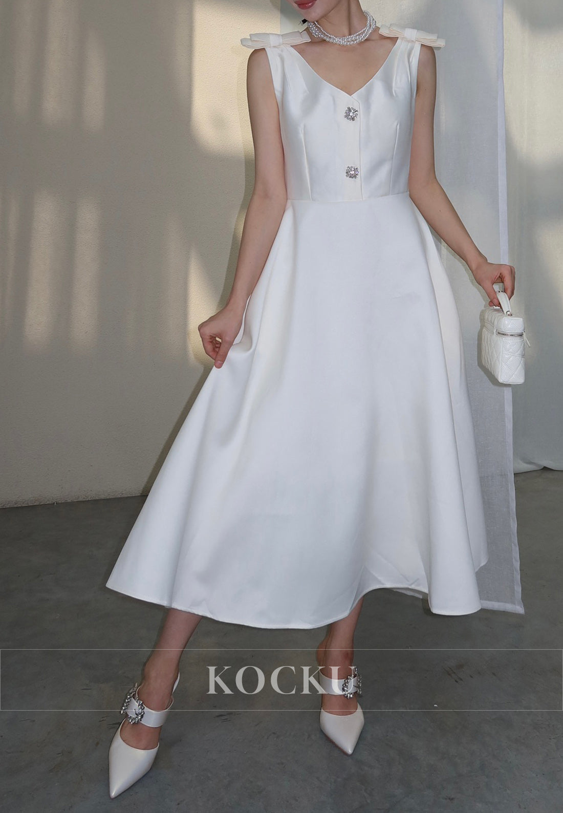 White Satin Midi Dress with Bow Shoulder Details and Crystal Buttons