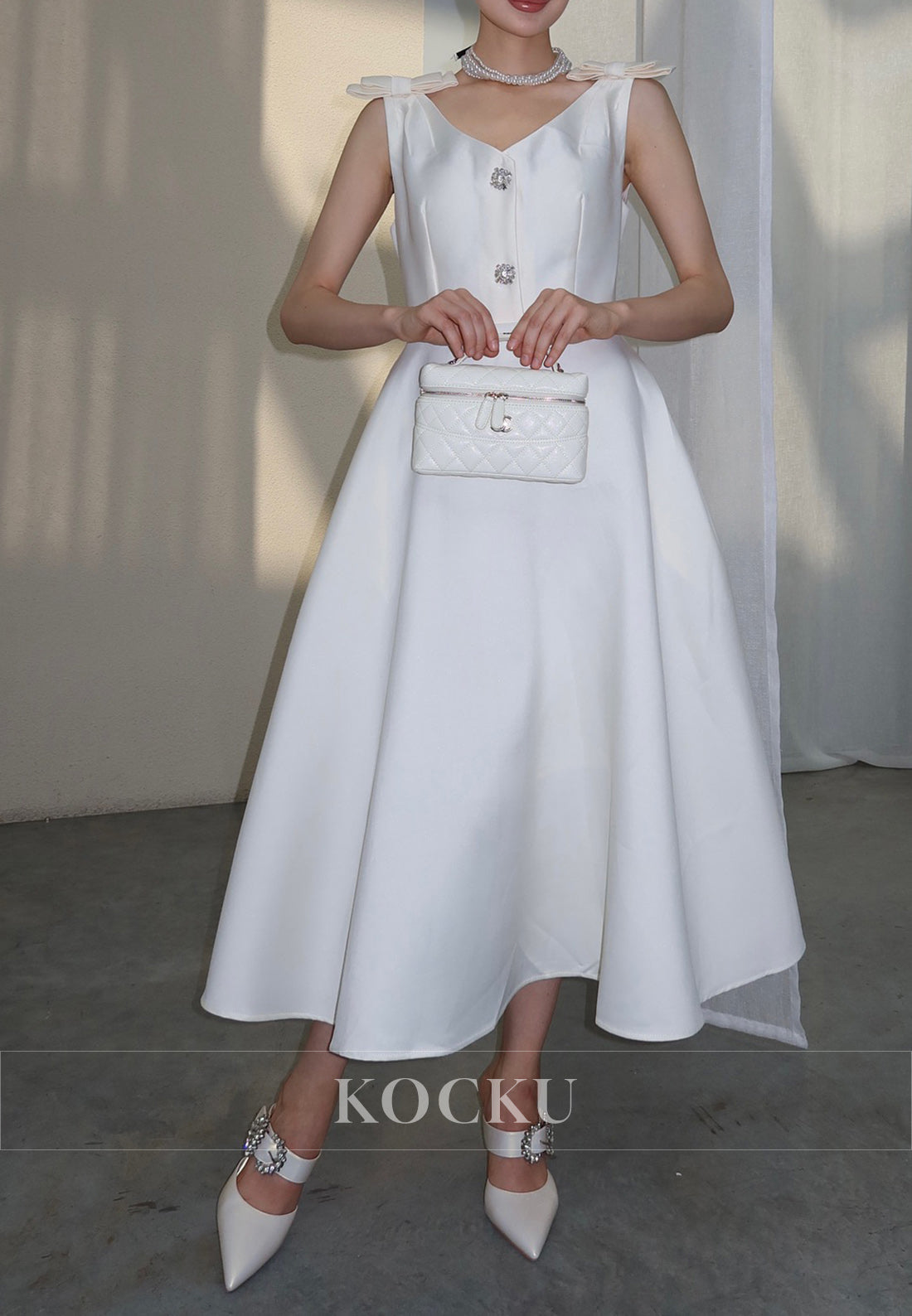 White Satin Midi Dress with Bow Shoulder Details and Crystal Buttons