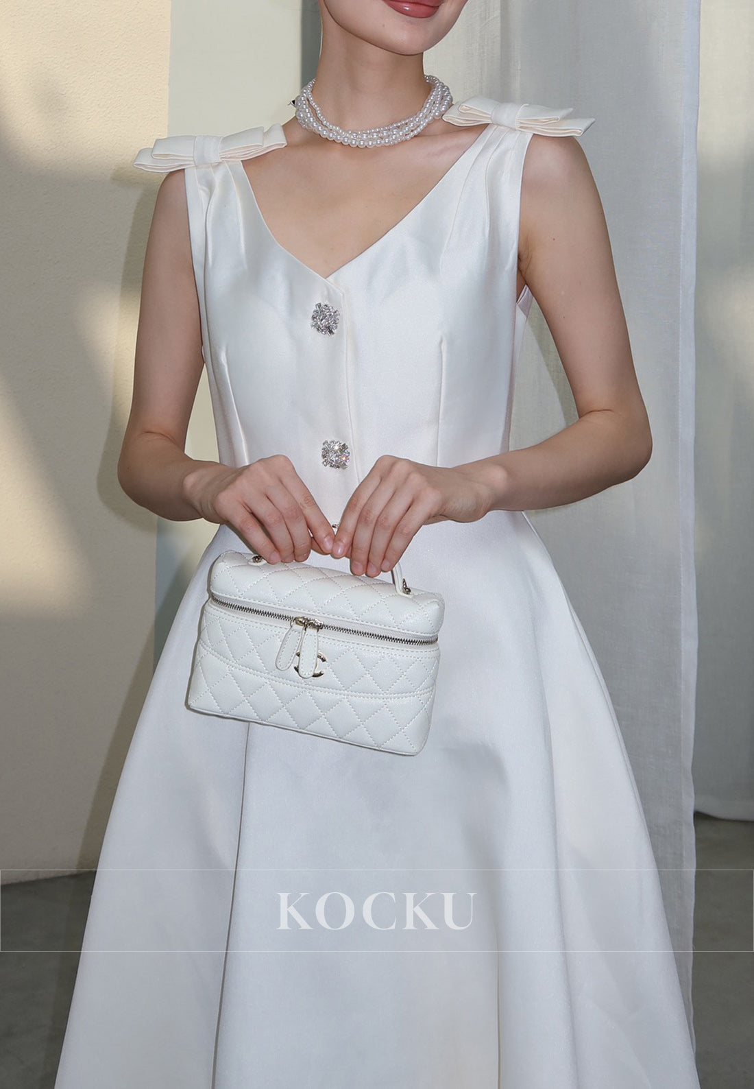 White Satin Midi Dress with Bow Shoulder Details and Crystal Buttons