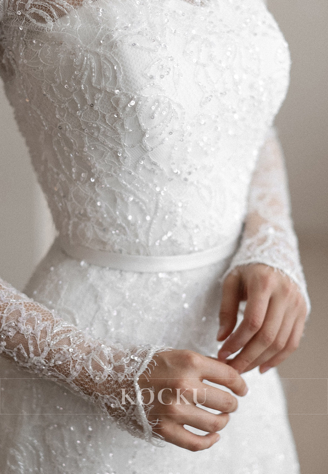 High - Neck Lace Wedding Dress with Sheer Long Sleeves and Sparkle Detailing