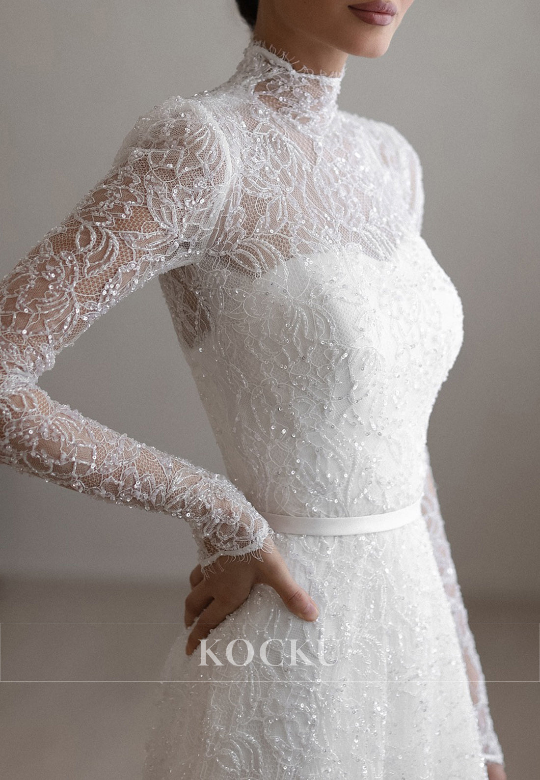High - Neck Lace Wedding Dress with Sheer Long Sleeves and Sparkle Detailing