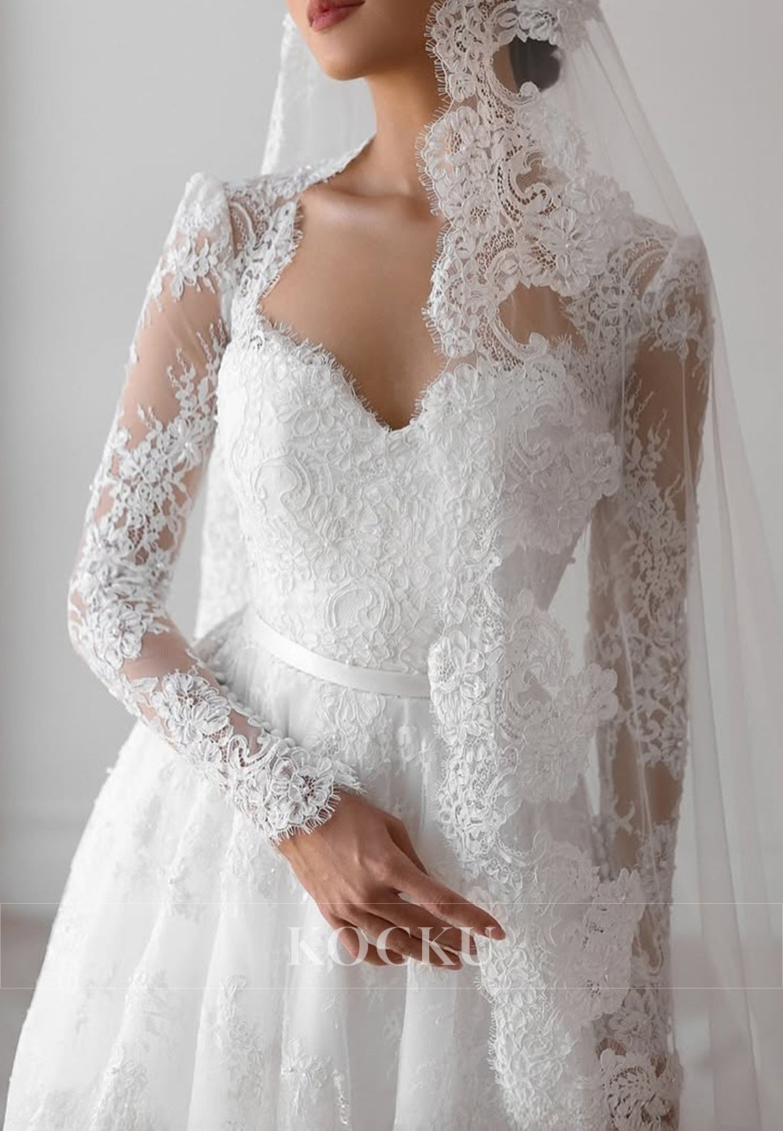 Romantic Lace Ball Gown Wedding Dress with Sheer Long Sleeves and Sweetheart Neckline