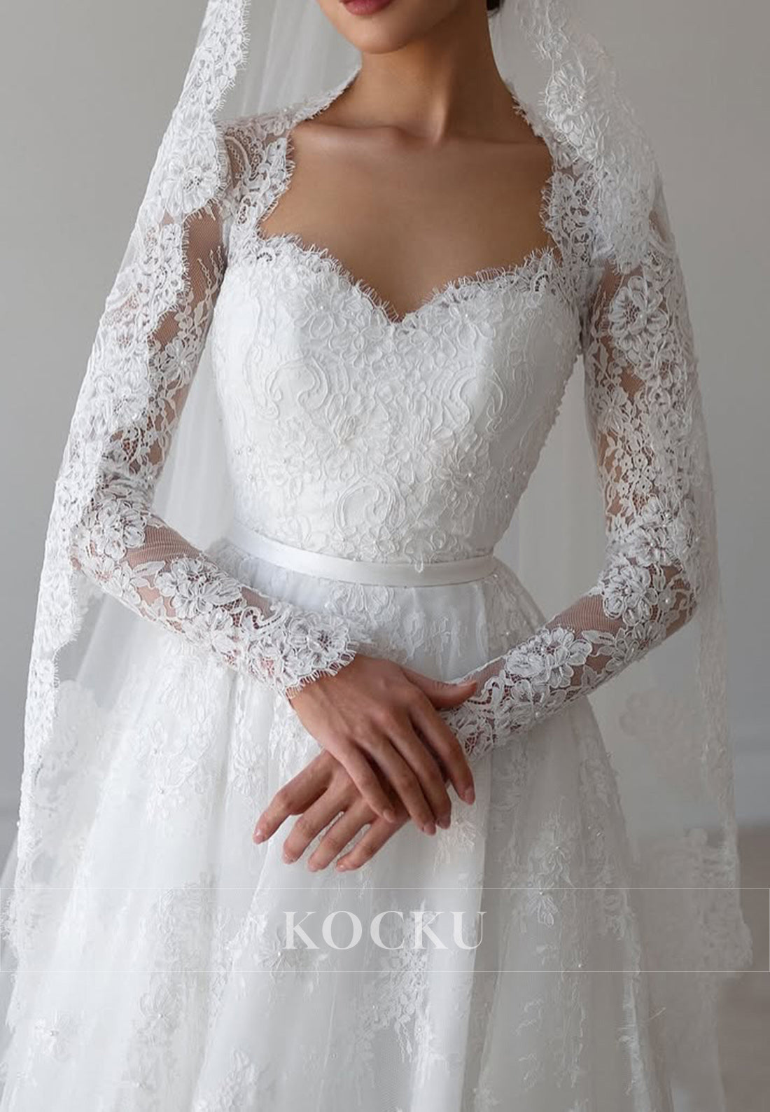 Romantic Lace Ball Gown Wedding Dress with Sheer Long Sleeves and Sweetheart Neckline