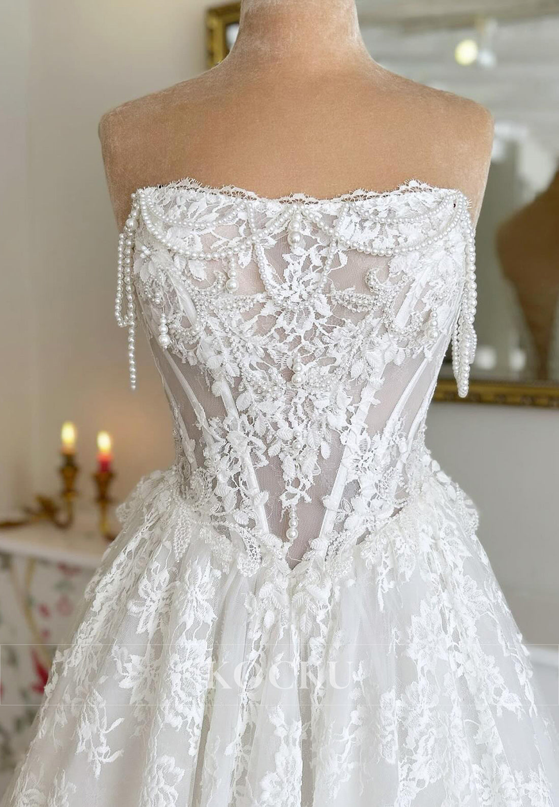 Timeless Strapless Lace Wedding Dress with Pearl Accents and Train