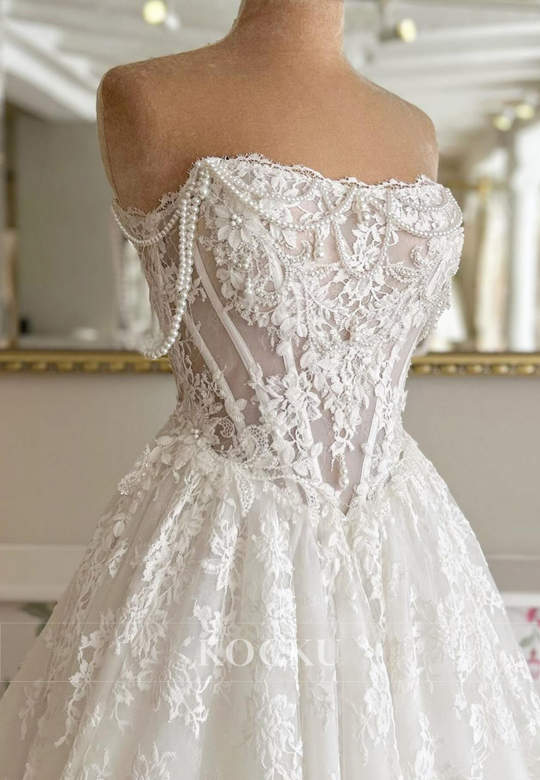 Timeless Strapless Lace Wedding Dress with Pearl Accents and Train